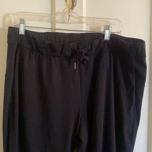 Black LULu Lemon travel pant, size 12. Drawstring waist with two front pockets.